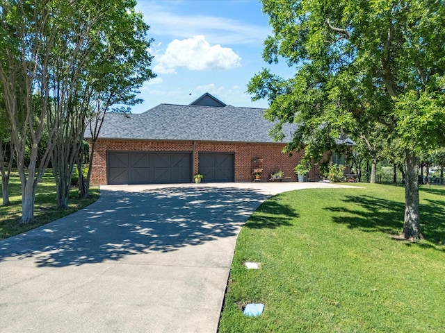 103 Marina Del Ray, Bridgeport, TX 76426 - view of front of home with brick siding, a front yard, a garage, and concrete driveway