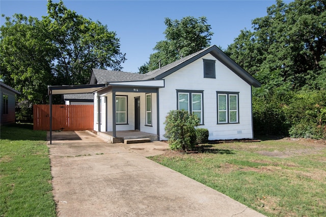 916 Wilde St, Denison, TX 75020 - view of front of home with concrete driveway, a porch, and roof with shingles