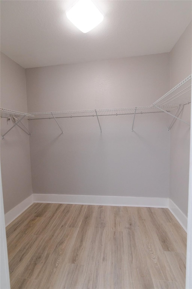 916 Wilde St, Denison, TX 75020 - spacious closet with light wood-style floors