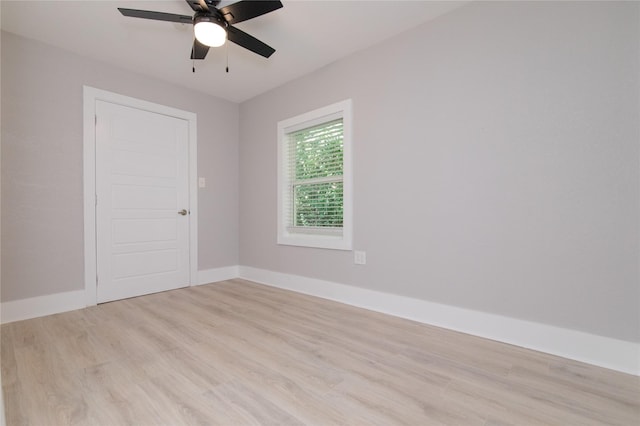 916 Wilde St, Denison, TX 75020 - spare room featuring light wood-type flooring, a ceiling fan, and baseboards