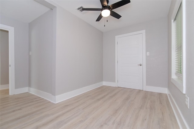 916 Wilde St, Denison, TX 75020 - empty room featuring light wood-type flooring, baseboards, and a ceiling fan