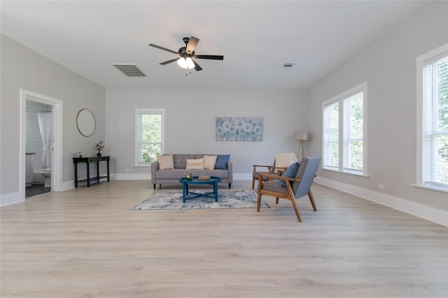 916 Wilde St, Denison, TX 75020 - living room featuring light wood finished floors, ceiling fan, and baseboards