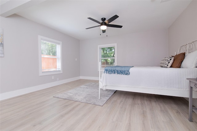 916 Wilde St, Denison, TX 75020 - bedroom with multiple windows, wood finished floors, baseboards, and a ceiling fan