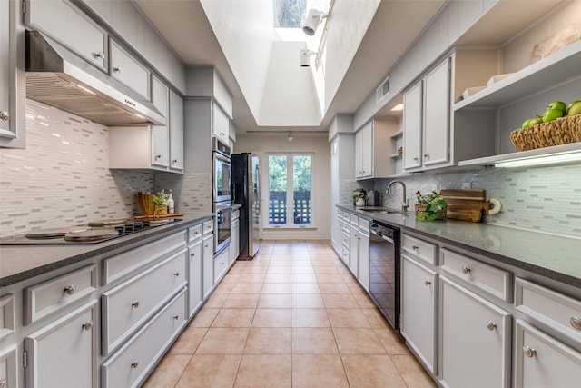 3984 Goodfellow Dr, Dallas, TX 75229 - kitchen with stainless steel appliances, under cabinet range hood, a sink, open shelves, and backsplash