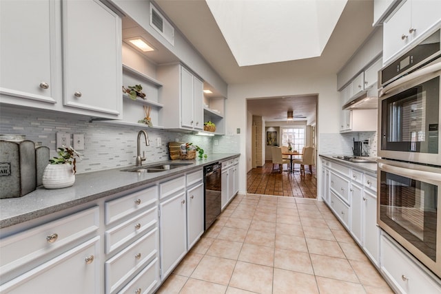 3984 Goodfellow Dr, Dallas, TX 75229 - kitchen featuring a sink, open shelves, black dishwasher, stainless steel double oven, and light tile patterned floors