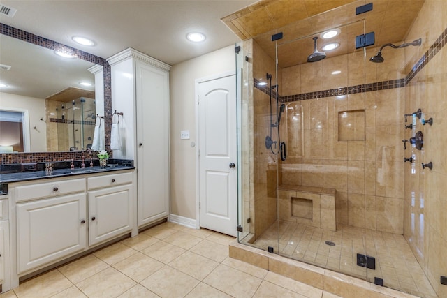 3984 Goodfellow Dr, Dallas, TX 75229 - full bathroom with a shower stall, vanity, tile patterned floors, baseboards, and recessed lighting