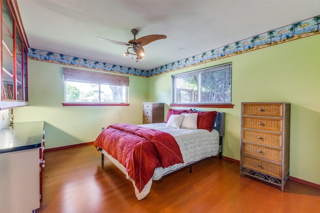 3984 Goodfellow Dr, Dallas, TX 75229 - bedroom with wood finished floors, baseboards, and ceiling fan