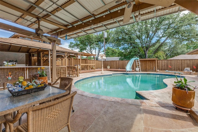 3984 Goodfellow Dr, Dallas, TX 75229 - view of swimming pool featuring a water slide, a patio, and a fenced backyard