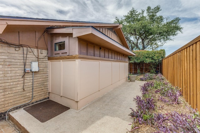 3984 Goodfellow Dr, Dallas, TX 75229 - view of home's exterior with board and batten siding and a fenced backyard