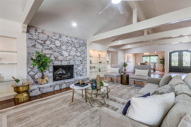 3984 Goodfellow Dr, Dallas, TX 75229 - living room featuring a ceiling fan, a stone fireplace, and french doors