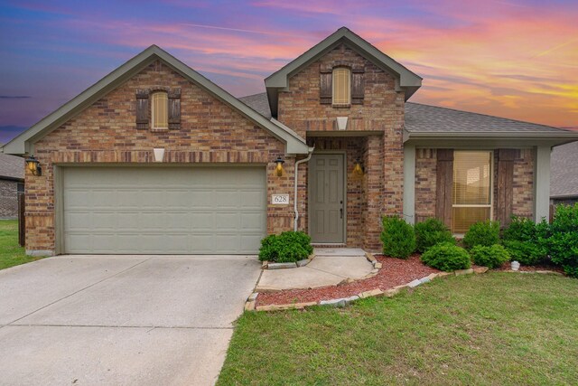 628 Cottage Pl, Lavon, TX 75166 - view of front of house featuring roof with shingles, brick siding, driveway, and a front yard