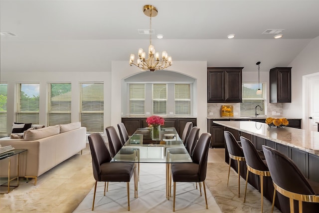 628 Cottage Pl, Lavon, TX 75166 - dining space featuring a chandelier and vaulted ceiling