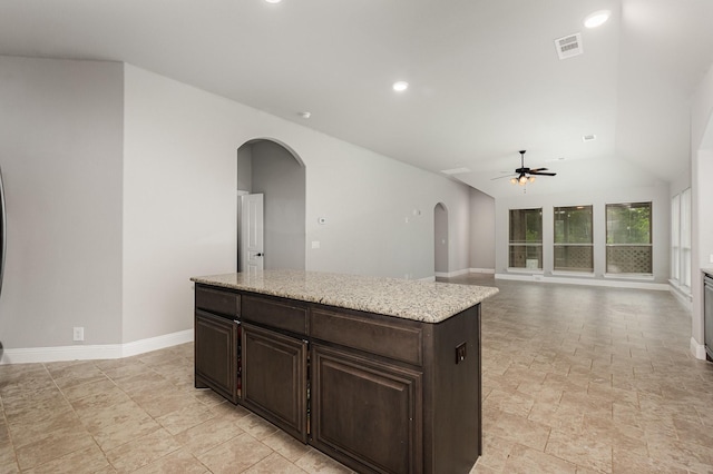 628 Cottage Pl, Lavon, TX 75166 - kitchen with arched walkways, ceiling fan, baseboards, dark brown cabinetry, and recessed lighting