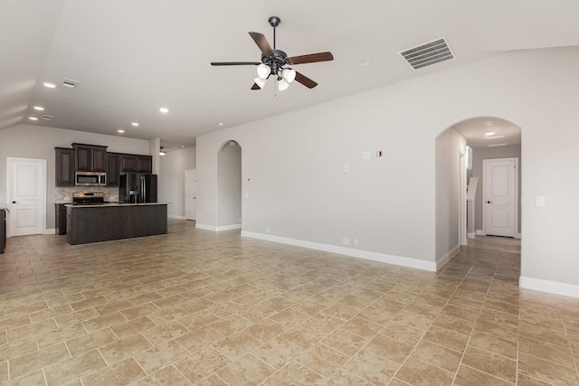 628 Cottage Pl, Lavon, TX 75166 - unfurnished living room featuring arched walkways, recessed lighting, a ceiling fan, vaulted ceiling, and baseboards