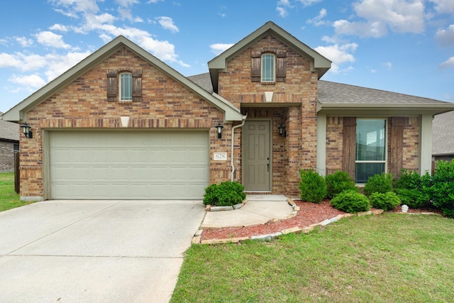 628 Cottage Pl, Lavon, TX 75166 - view of front of house with brick siding, a shingled roof, driveway, and a front lawn