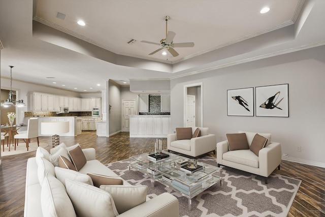 5020 Still Meadow Dr, Fort Worth, TX 76132 - living area featuring a tray ceiling, a ceiling fan, dark wood-style floors, crown molding, and recessed lighting
