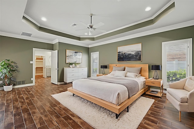 5020 Still Meadow Dr, Fort Worth, TX 76132 - bedroom with a tray ceiling, dark wood-style flooring, crown molding, recessed lighting, and baseboards