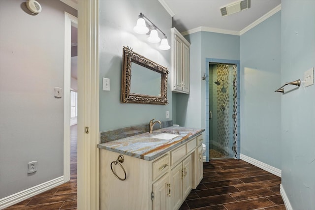 5020 Still Meadow Dr, Fort Worth, TX 76132 - full bathroom featuring wood finish floors, a stall shower, vanity, baseboards, and crown molding