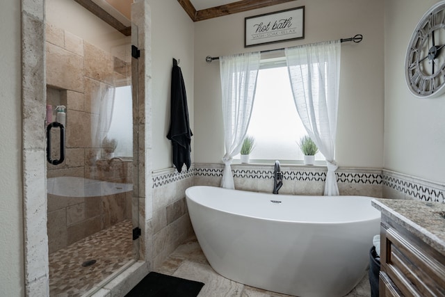 3547 County Road 1092, Celeste, TX 75423 - full bath with healthy amount of natural light, a freestanding bath, a stall shower, tile walls, and vanity