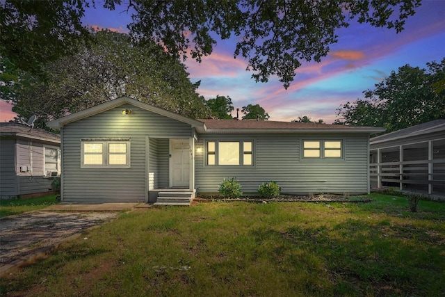 1043 Star St, Denison, TX 75020 - view of front of home featuring a yard