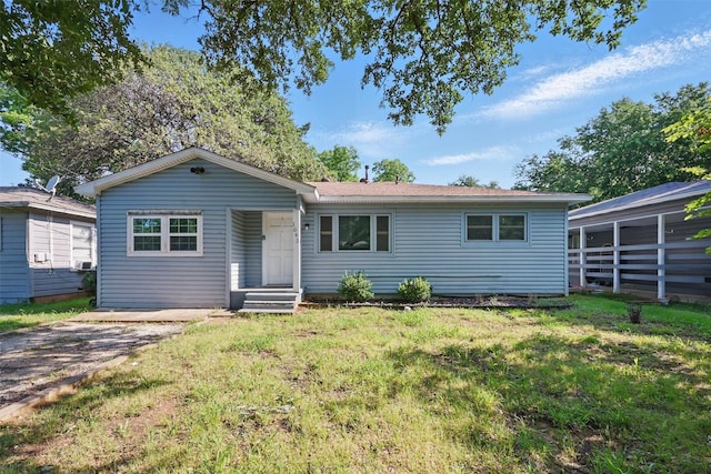 1043 Star St, Denison, TX 75020 - ranch-style home with a front lawn