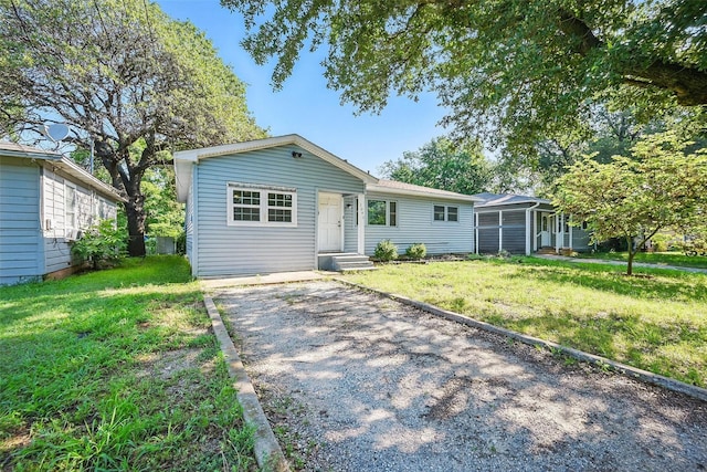 1043 Star St, Denison, TX 75020 - view of front of house featuring a front yard