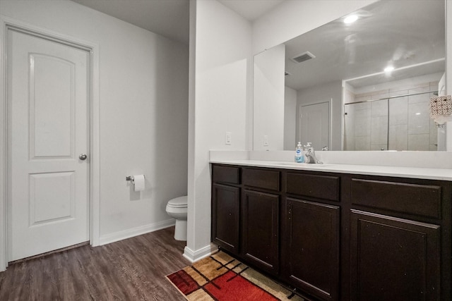 113 Hamilton Way, Venus, TX 76084 - bathroom with vanity, toilet, wood finished floors, baseboards, and a tile shower