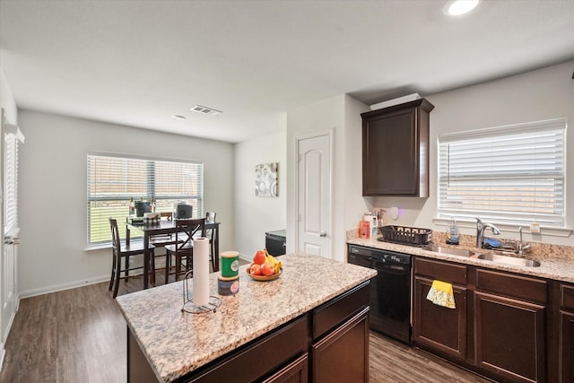 113 Hamilton Way, Venus, TX 76084 - kitchen featuring black dishwasher, a sink, dark brown cabinetry, and wood finished floors