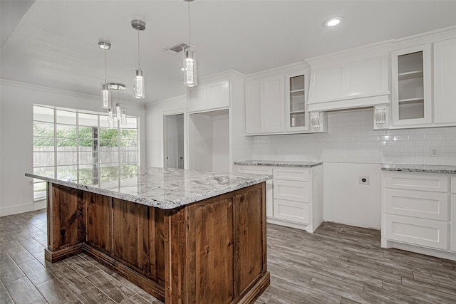 3408 Walton Ave, Fort Worth, TX 76133 - kitchen featuring light stone countertops, wood finished floors, white cabinets, a chandelier, and crown molding
