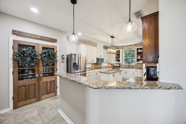 18818 Webb Ln, Nevada, TX 75173 - kitchen with stainless steel appliances, open shelves, tasteful backsplash, white cabinetry, and light stone countertops