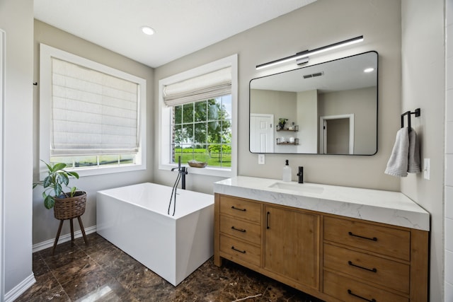 18818 Webb Ln, Nevada, TX 75173 - full bathroom with vanity, a freestanding bath, baseboards, and recessed lighting
