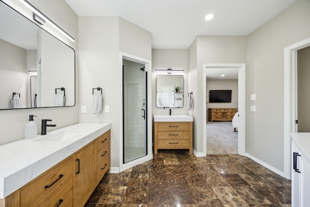 18818 Webb Ln, Nevada, TX 75173 - full bathroom with two vanities, ensuite bath, a shower stall, baseboards, and recessed lighting