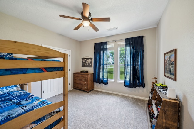 18818 Webb Ln, Nevada, TX 75173 - carpeted bedroom featuring baseboards, a ceiling fan, and a textured ceiling