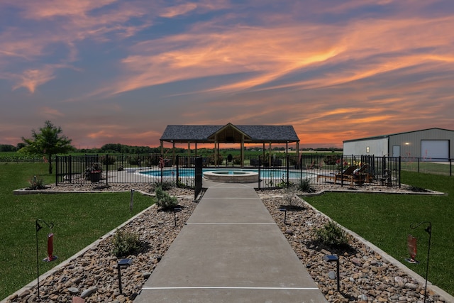 18818 Webb Ln, Nevada, TX 75173 - pool at dusk featuring a gazebo and a pool with connected hot tub