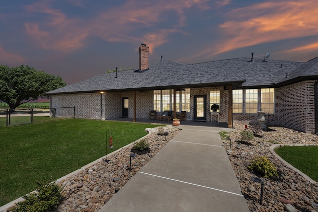 18818 Webb Ln, Nevada, TX 75173 - rear view of house with brick siding, a patio, and a chimney