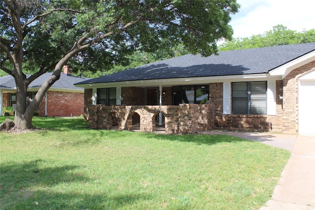 3026 San Miguel Dr, Abilene, TX 79605 - single story home with roof with shingles, brick siding, and a front yard