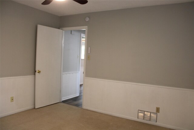 3026 San Miguel Dr, Abilene, TX 79605 - carpeted spare room with a wainscoted wall and ceiling fan