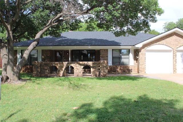 3026 San Miguel Dr, Abilene, TX 79605 - ranch-style home with brick siding, an attached garage, roof with shingles, a front lawn, and concrete driveway