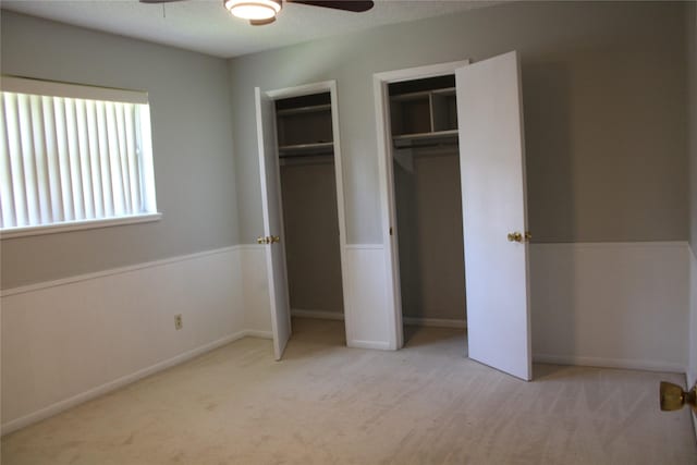 3026 San Miguel Dr, Abilene, TX 79605 - unfurnished bedroom with two closets, carpet flooring, and a ceiling fan