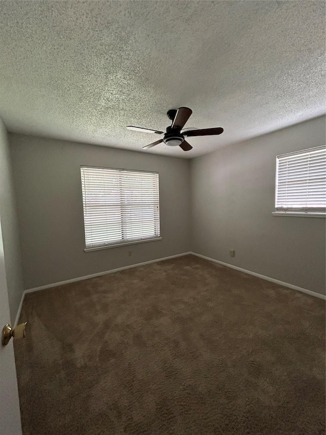 3026 San Miguel Dr, Abilene, TX 79605 - carpeted empty room featuring plenty of natural light, a textured ceiling, ceiling fan, and baseboards