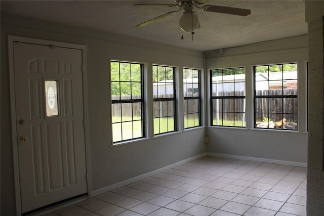 3026 San Miguel Dr, Abilene, TX 79605 - unfurnished sunroom with healthy amount of natural light, tile patterned floors, and baseboards
