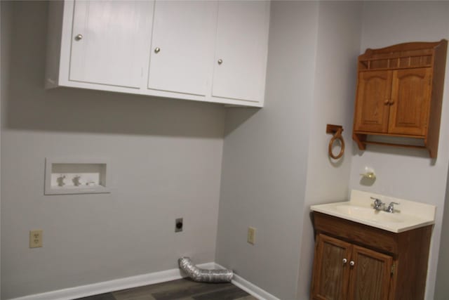 3026 San Miguel Dr, Abilene, TX 79605 - washroom featuring electric dryer hookup, cabinet space, wood finished floors, baseboards, and hookup for a washing machine