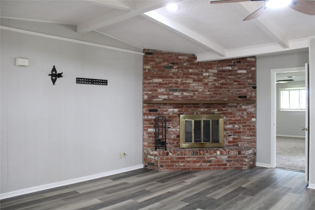 3026 San Miguel Dr, Abilene, TX 79605 - unfurnished living room featuring a ceiling fan, wood finished floors, a brick fireplace, and baseboards