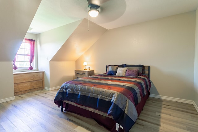 279 County Road 3470, Paradise, TX 76073 - bedroom with wood finished floors, baseboards, vaulted ceiling, and ceiling fan