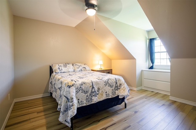279 County Road 3470, Paradise, TX 76073 - bedroom with wood finished floors, vaulted ceiling, baseboards, and a ceiling fan
