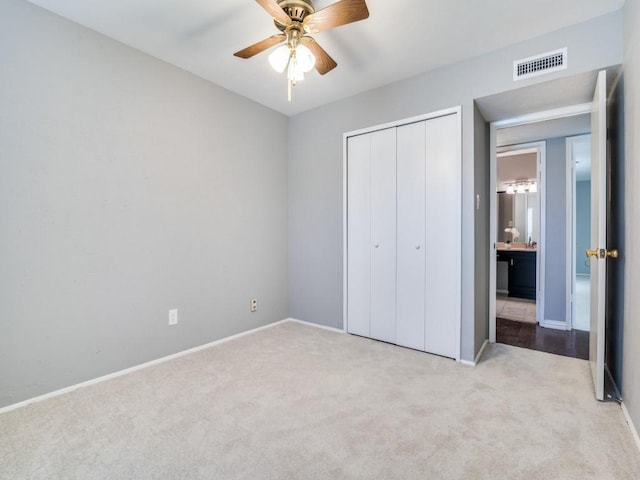 4552 Fremont Ln, Plano, TX 75093 - unfurnished bedroom featuring carpet, a closet, baseboards, and ceiling fan