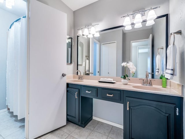4552 Fremont Ln, Plano, TX 75093 - bathroom featuring double vanity and tile patterned floors