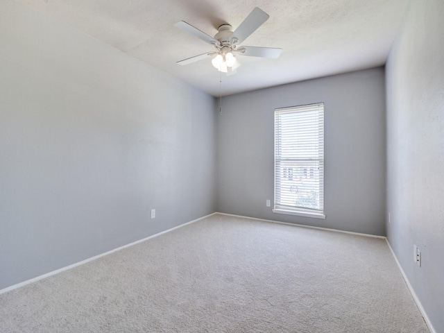 4552 Fremont Ln, Plano, TX 75093 - unfurnished room featuring carpet flooring, a ceiling fan, and baseboards
