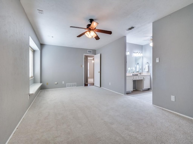 4552 Fremont Ln, Plano, TX 75093 - unfurnished living room with a ceiling fan, light carpet, and baseboards
