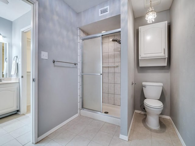 4552 Fremont Ln, Plano, TX 75093 - bathroom with baseboards, tile patterned flooring, a shower stall, vanity, and toilet